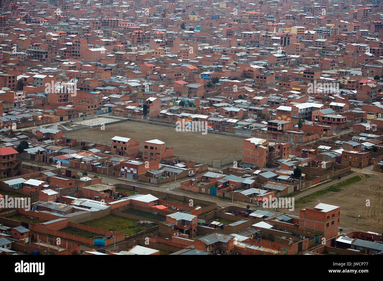 Brick buildings of El Alto (4150m/13,615ft), La Paz, Bolivia, South America - aerial Stock Photo