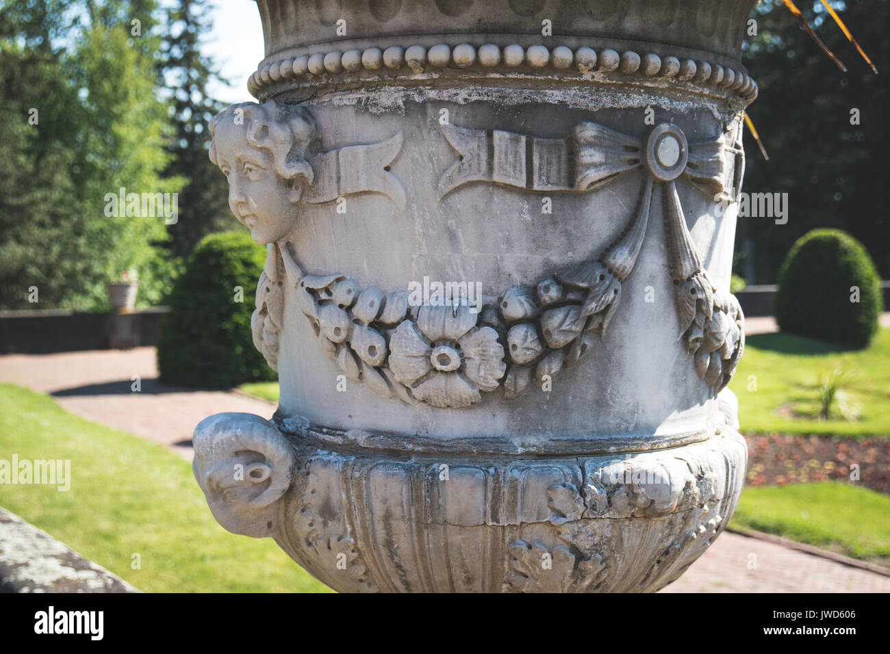 Decorative Stone Planter Urn In A Large Garden Stock Photo