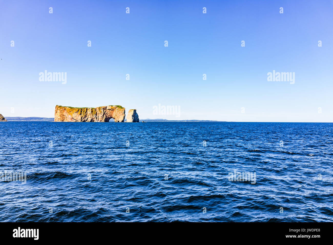 Rocher Perce rock in Gaspe Peninsula, Quebec, Gaspesie region with dark