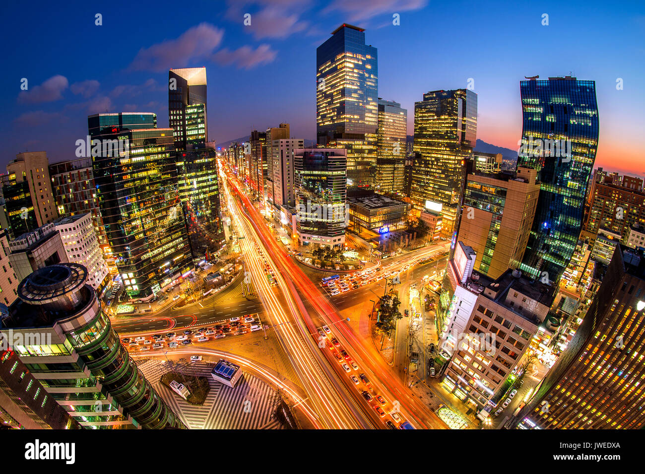 Cityscape of South Korea. Night traffic speeds through an intersection in the Gangnam district of Seoul,South Korea. Stock Photo