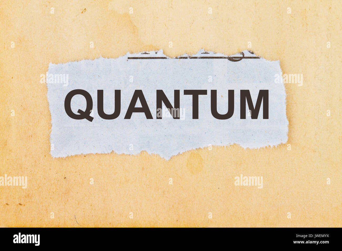 Quantum newspaper cutout in an old paper background. Stock Photo