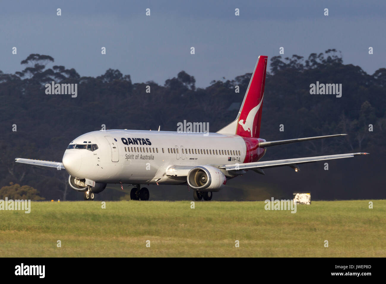 Qantas Boeing 737-476 VH-TJL on the runway at  Melbourne International Airport. Stock Photo