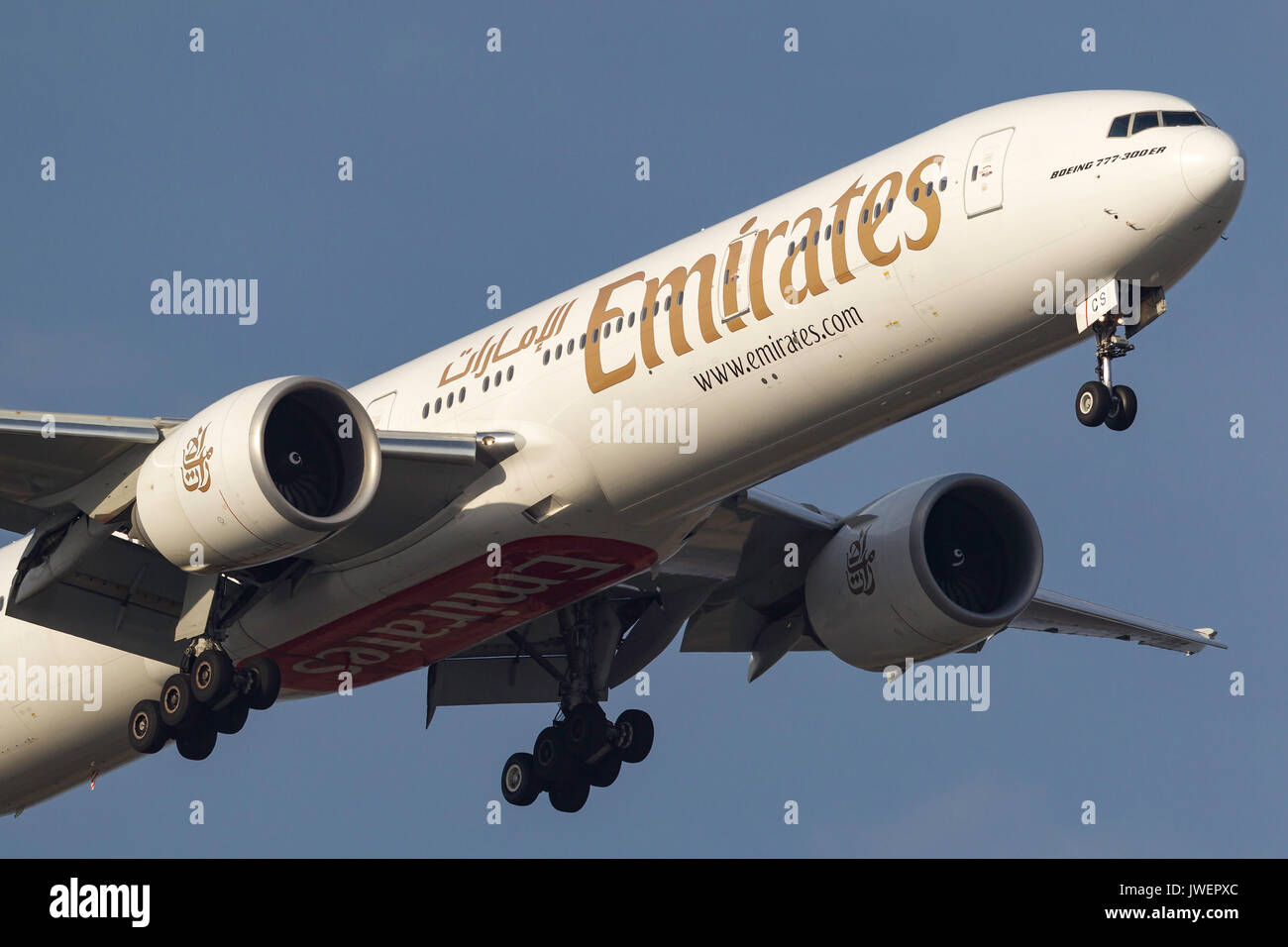Emirates Boeing 777-31H/ER A6-ECS on approach to land at Melbourne International Airport. Stock Photo
