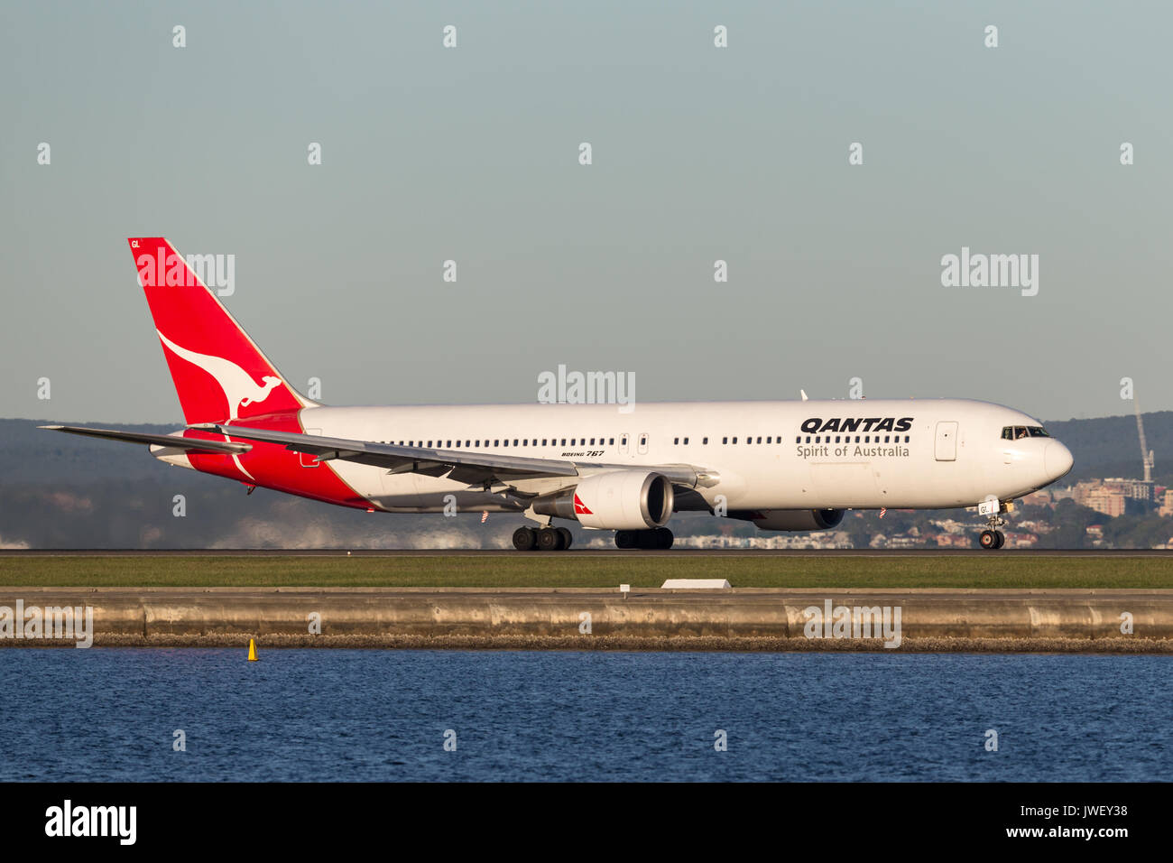 Qantas Boeing 767 airliner taking off from Sydney Airport. Stock Photo