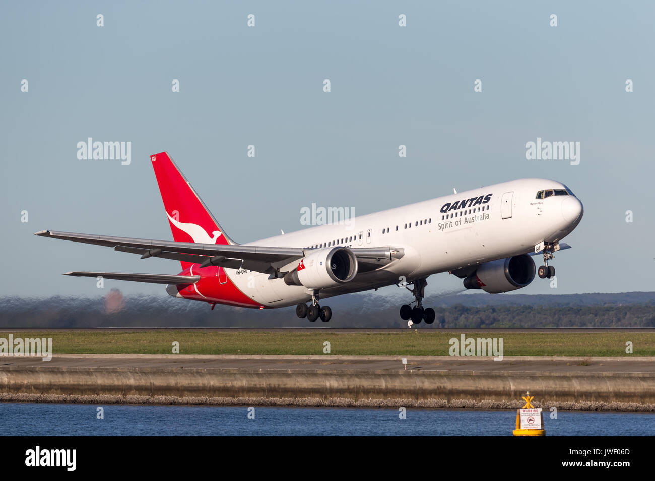 Qantas Boeing 767 airliner taking off from Sydney Airport. Stock Photo