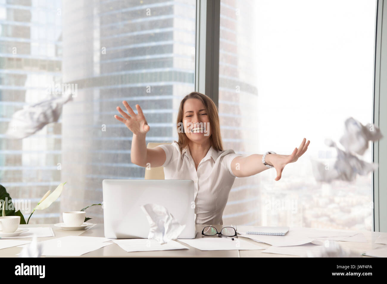 Stressed hysterical woman throwing crumpled paper, nervous break Stock Photo Alamy