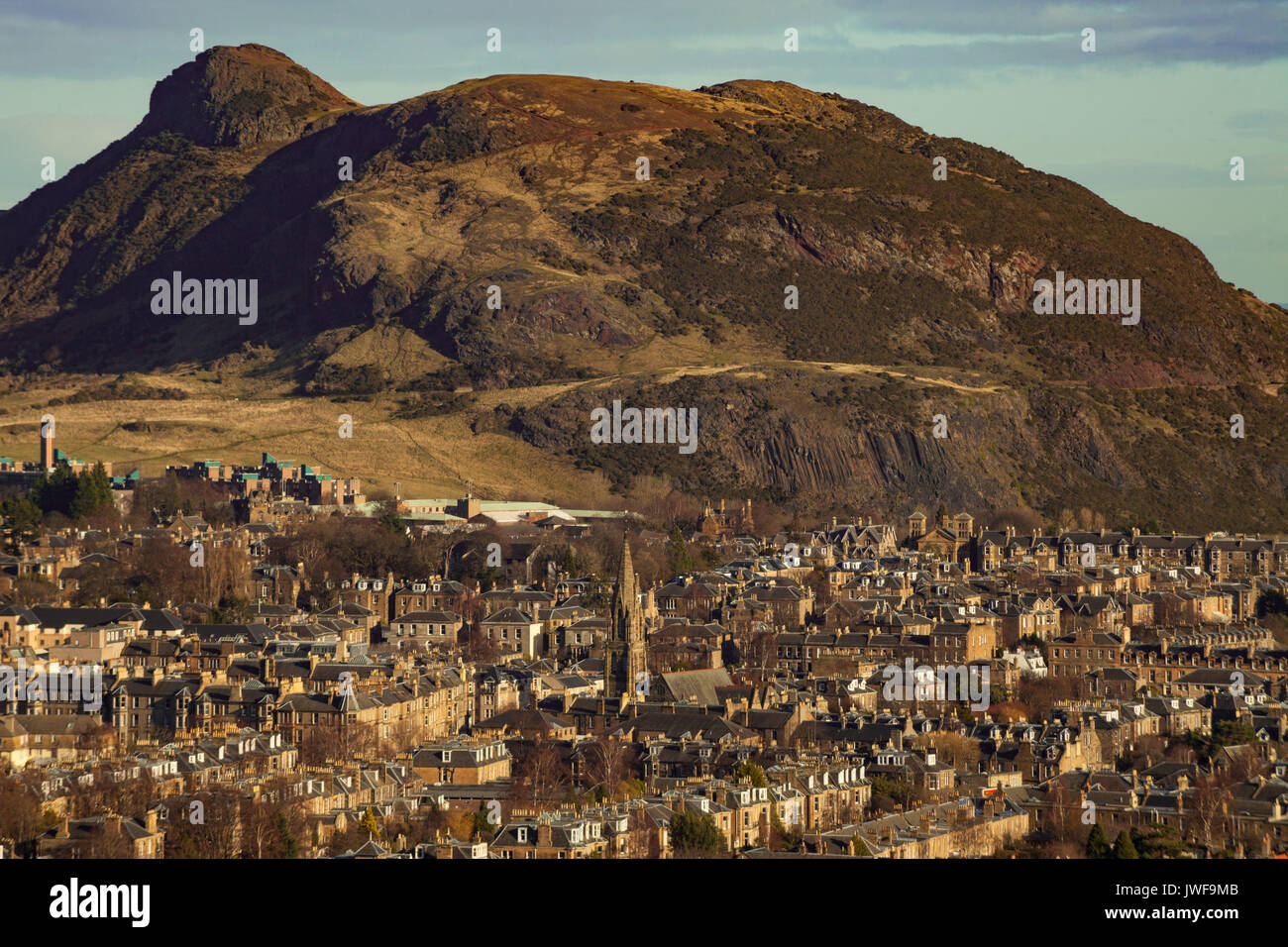 view across rooftops to Arthur's Seat in Edinburgh Stock Photo
