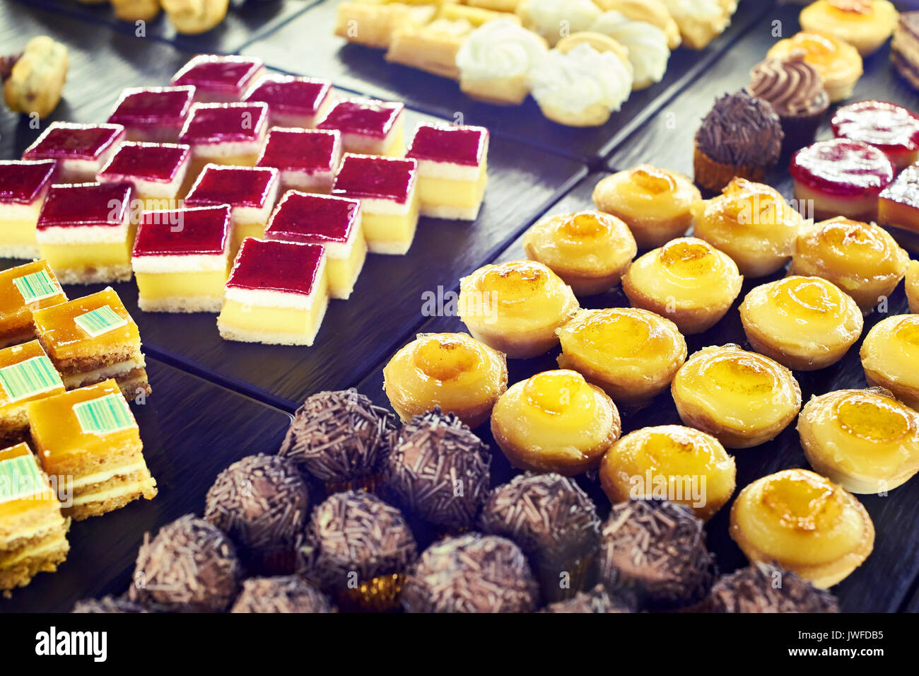 Sweet cakes in the cafe showcase Stock Photo Alamy