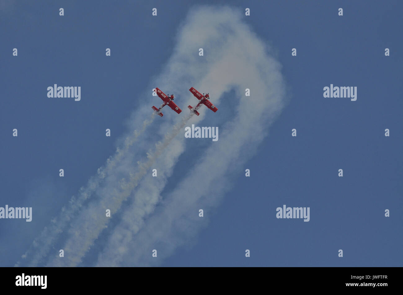 Red airplanes on the blue sky backgorund during airshow in Gdynia ...
