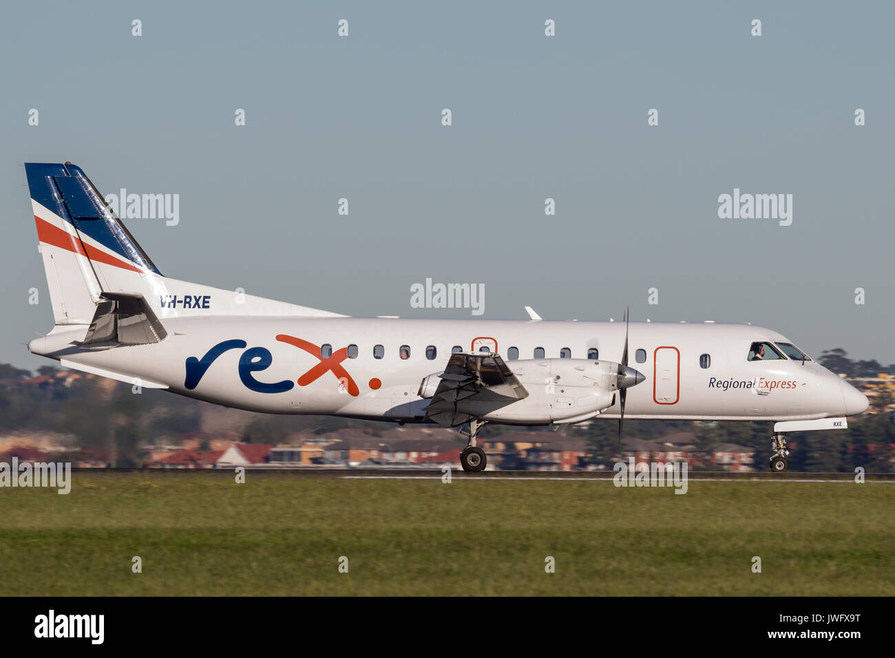 REX (Regional Express Airlines) Saab 340 twin engined regional commuter aircraft at Sydney Airport. Stock Photo