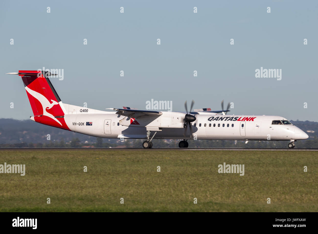 QantasLink (Qantas) deHavilland DHC-8 (Dash 8) twin engined regional airliner aircraft at Sydney Airport. Stock Photo