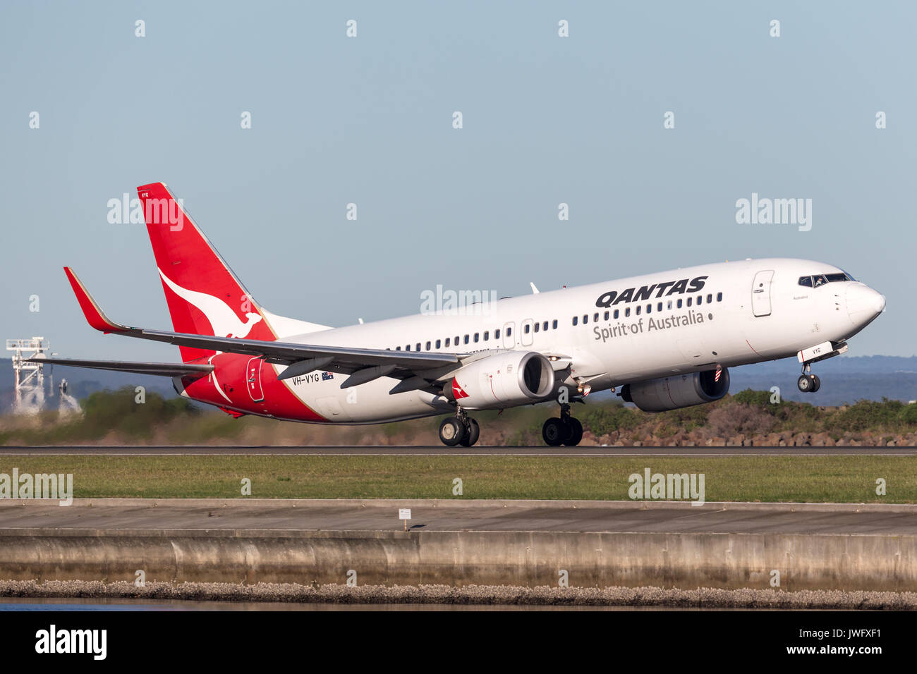 Qantas Boeing 737-800 aircraft taking off from Sydney Airport. Stock Photo
