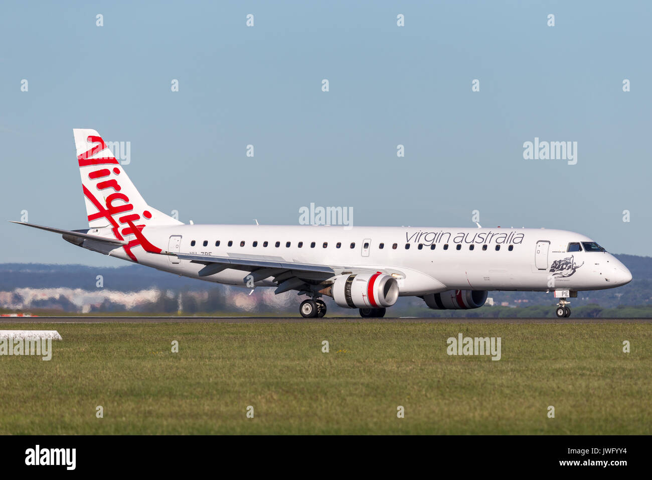 Virgin Australia Embraer regional jet (ERJ-190) takes off from Sydney Airport. Stock Photo