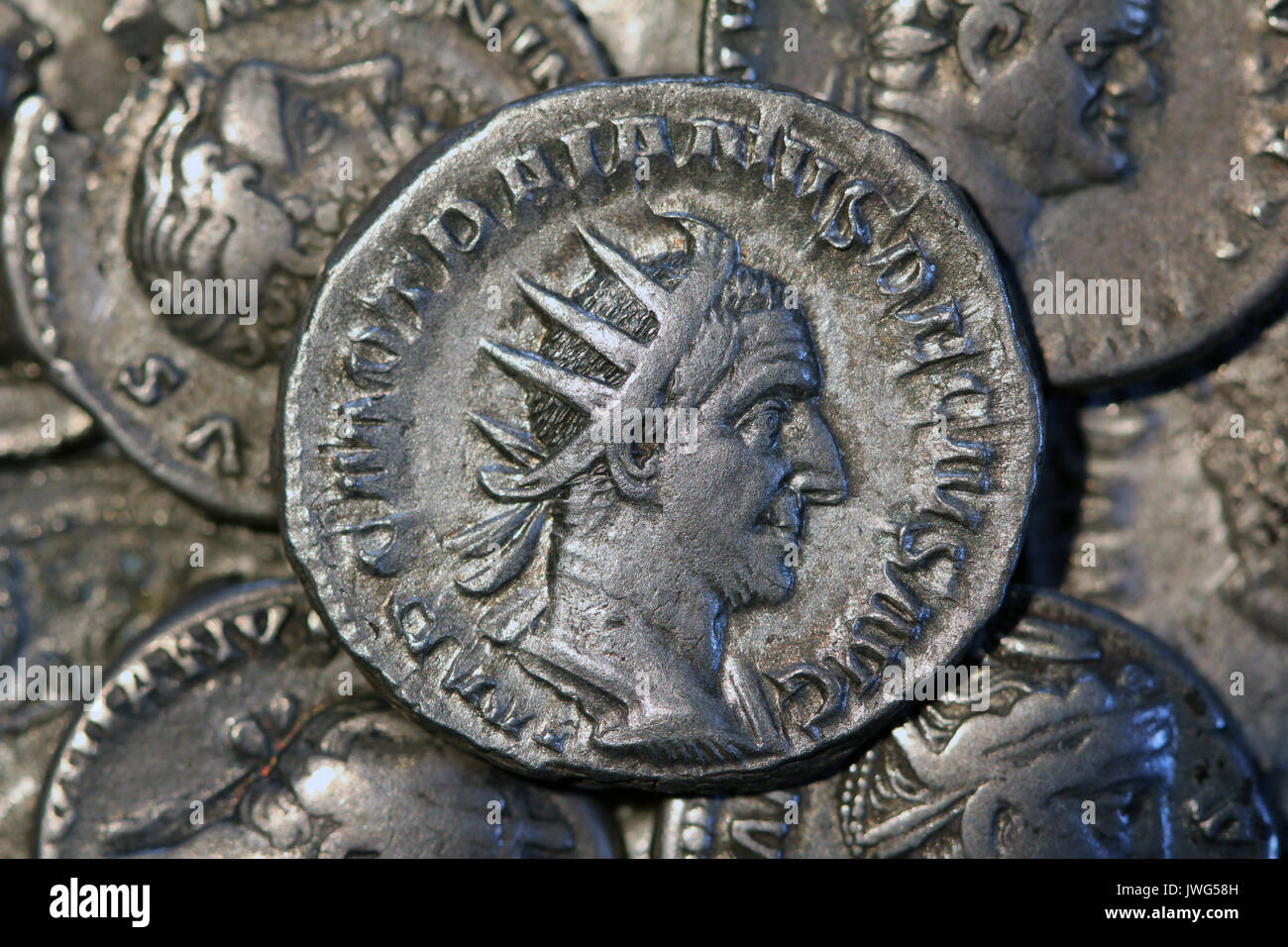 Examining antique silver coin Stock Photo - Alamy