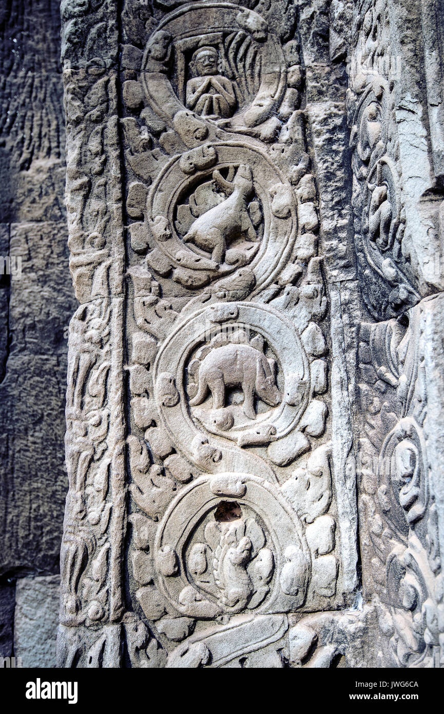 sculpted stone depicting a dinosaur at the ancient Ta Prohm temple at Angkor Wat, Siem Reap, Cambodia. Stock Photo