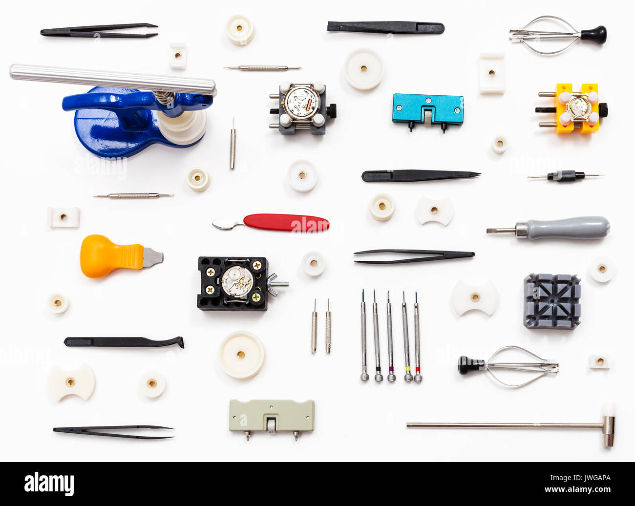 watchmaker workshop - ornament from various watch repairing tools on white background Stock Photo