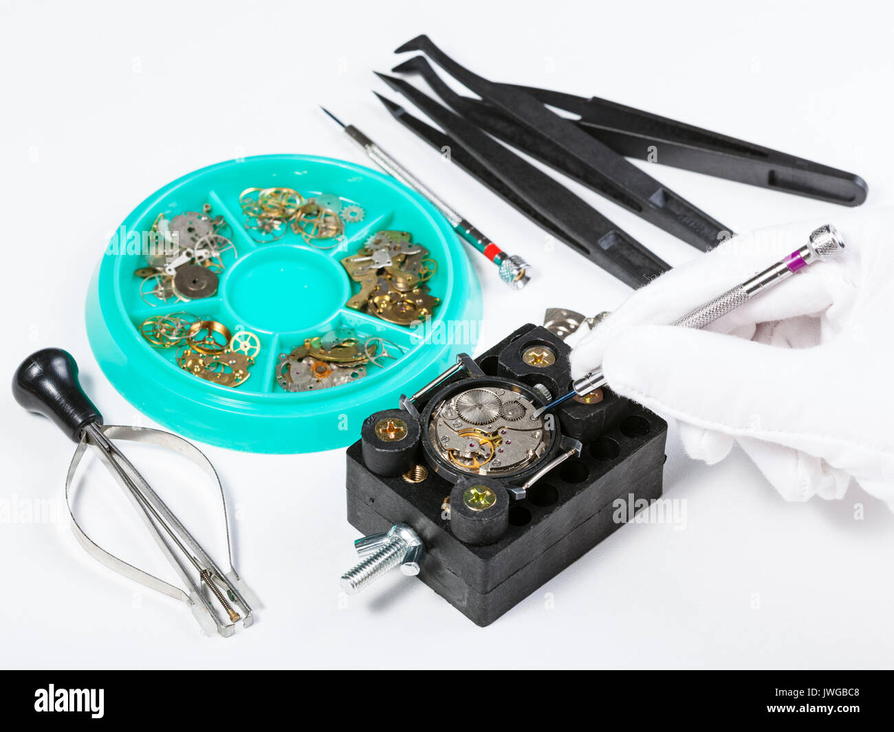 watchmaker workshop - repairing old mechanical watch on white table Stock Photo