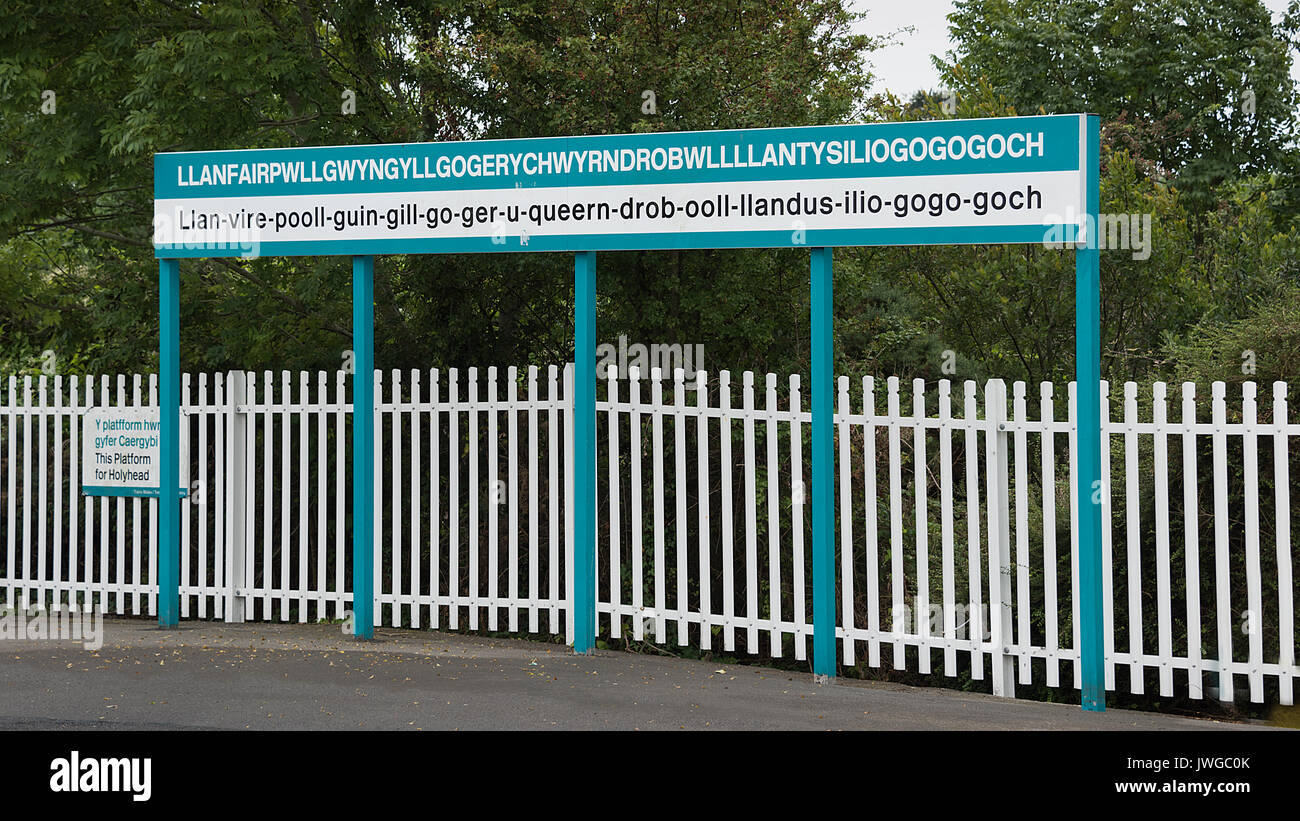The station platform sign of the longest place name in the world which is situated in Wales UK. Llanfairpwllgwyngyllgogerychwyrndrobwllllantysiliogogo Stock Photo