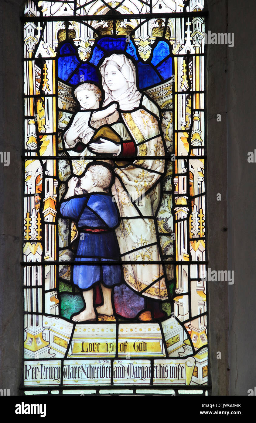 Love is of God stained glass window Church of Saint Mary, Coddenham, Suffolk, England, UK Stock Photo