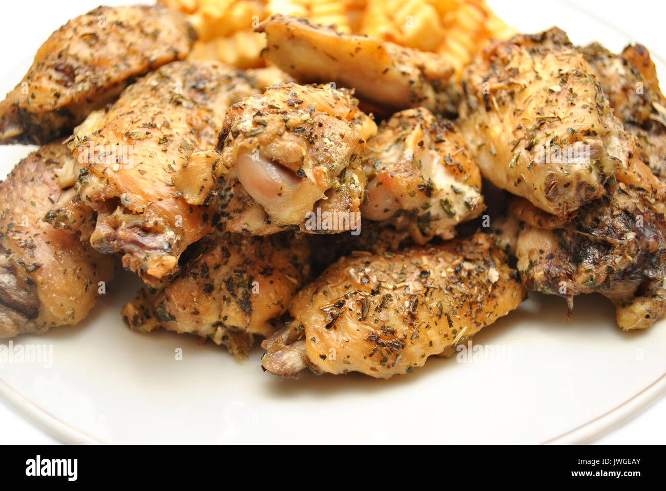 Crispy Grilled Italian Spiced Chicken Wing Pieces Stock Photo Alamy