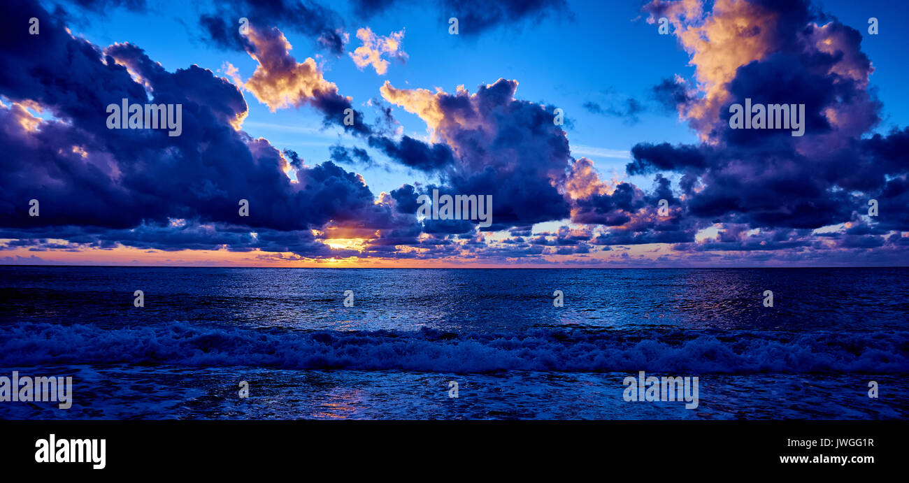 sunset over ocean. Sunset on the beach with beautiful sky. Dramatic ...