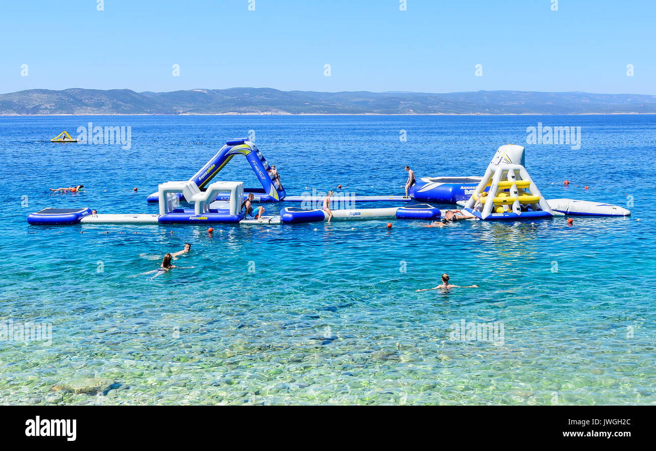 Inflatable slide on the sea. Brela, Croatia. Stock Photo