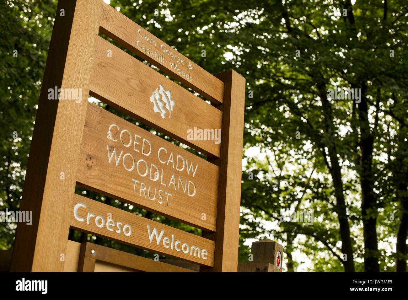 Coed Cadw Woodland Trust welcome sign at Cwm George & Casehill Woods near Cardiff, Vale of Glamorgan, Wales, UK. Stock Photo
