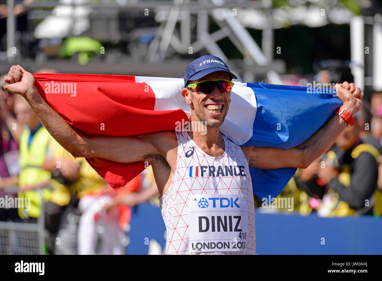 Yohann Diniz of France celebrating winning gold in the IAAF World Athletics Championships 50k walk in The Mall, London. French flag Stock Photo