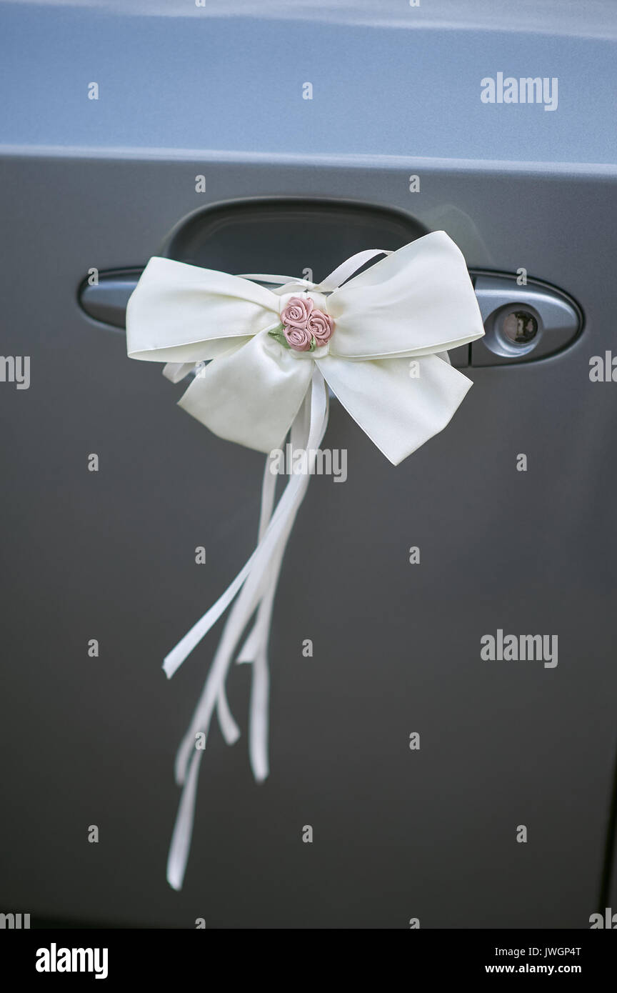 Decorative bow on car handle for wedding decor Stock Photo