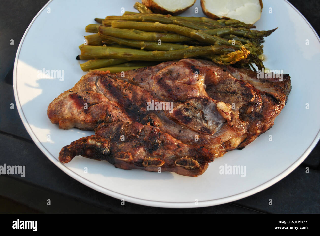 Lamb Chop Served with Tasty Sides Stock Photo