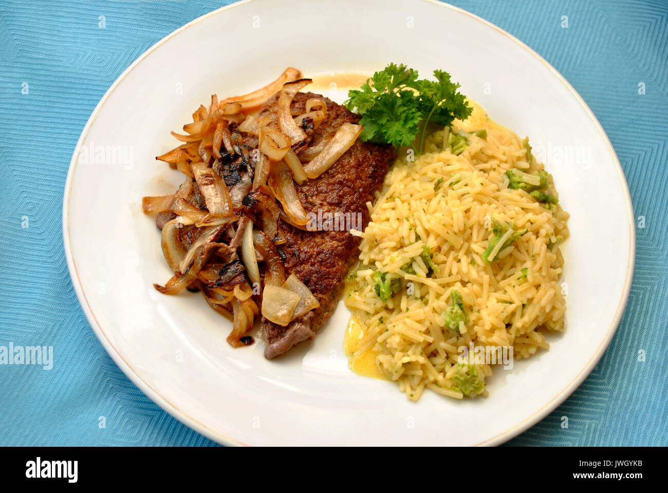 Rice Served with Cube Steaks Smothered with Fried Onions Stock Photo ...
