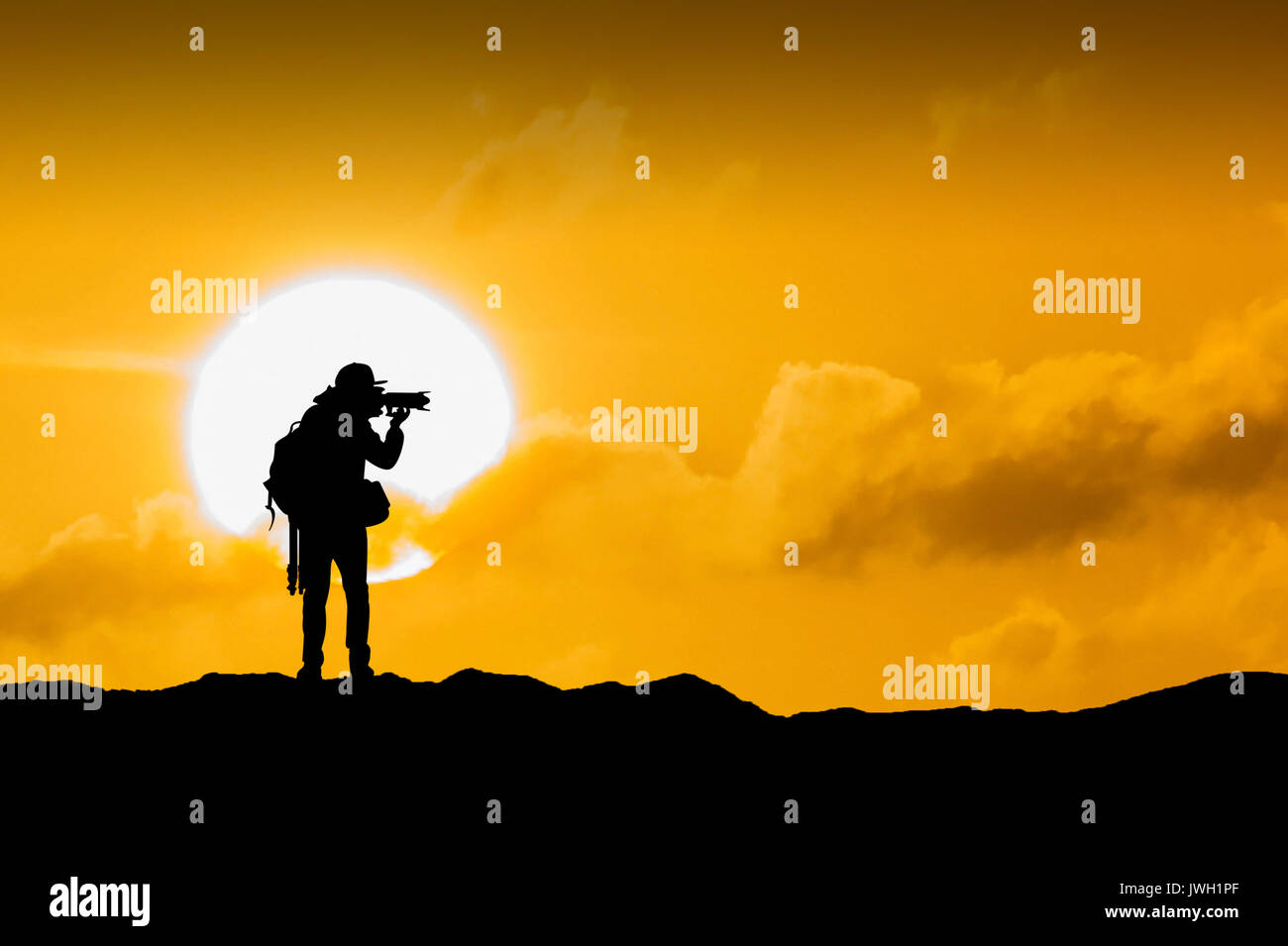Silhouette of photographer with camera at sunset Stock Photo - Alamy