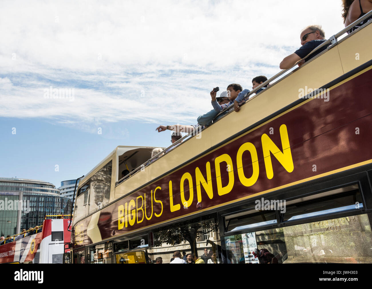 An open top Big Bus London tours bus on Westminster Bridge, London, UK Stock Photo