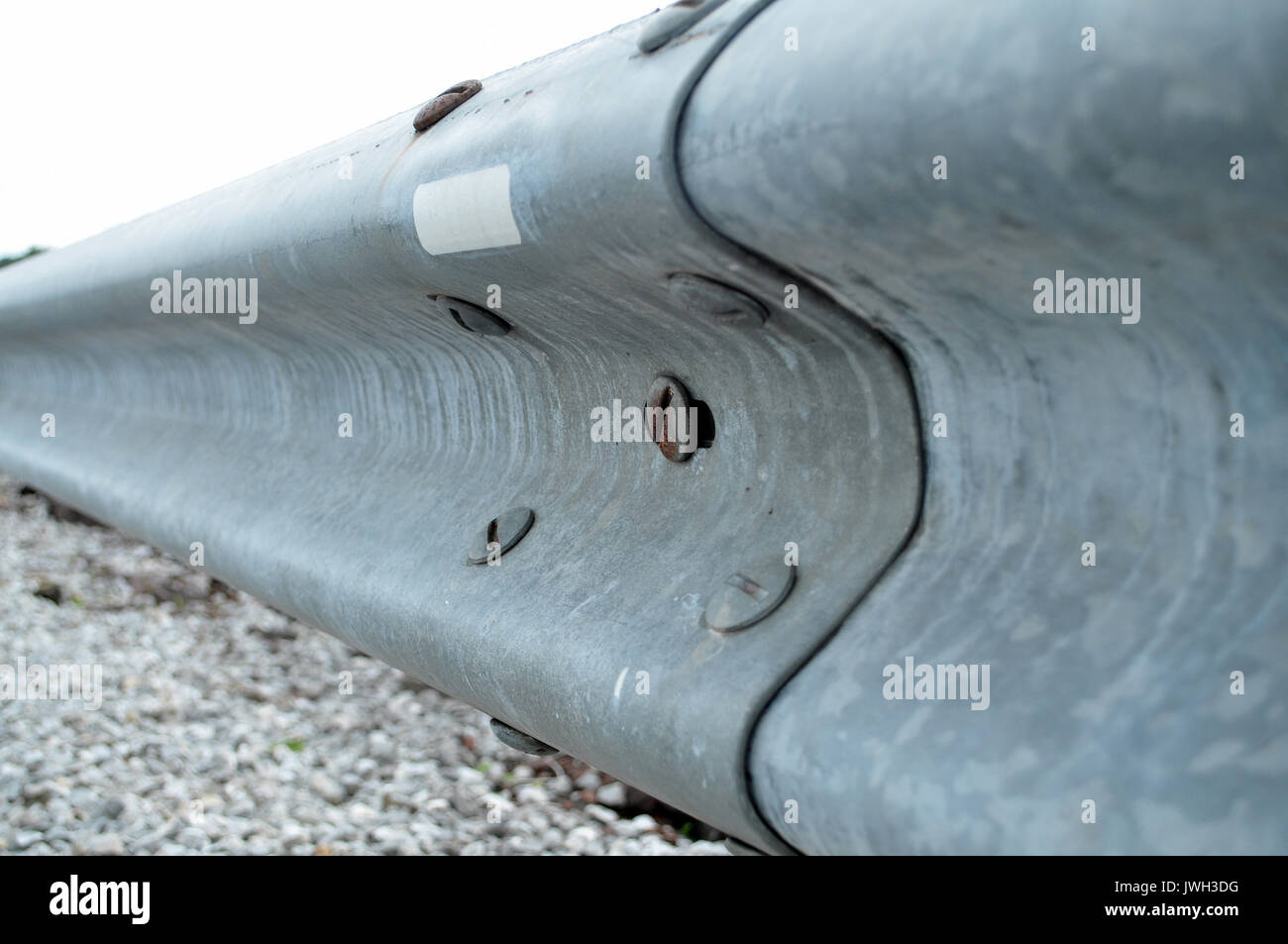Guard rail or guardrail, sometimes referred to as guide rail or railing, is a system designed to