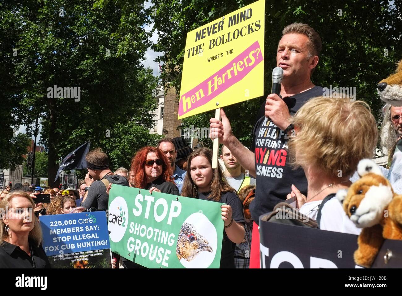 London, UK 12th August 2017. Wildlife TV presenter Chris Packham and organiser of the protest addresses the crowd. To coincide with the first day of the grouse season known as the 'Glorious 12th' hundreds of Anti Blood Sports protesters gather  outside Downing Street to demonstrate against the killing of animals for sport. :Credit: Claire Doherty Alamy/Live News Stock Photo