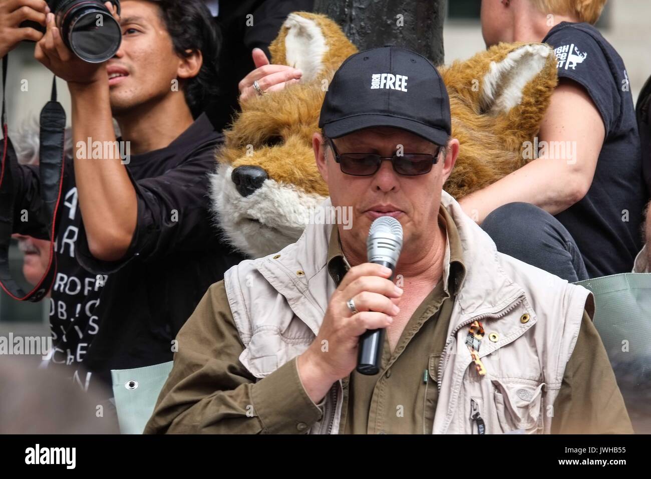 London, UK 12th August 2017. Will Travers son of  Virginia McKenna,Born Free Foundation addresses the crowd. To coincide with the first day of the grouse season known as the 'Glorious 12th' hundreds of Anti Blood Sports protesters gather  outside Downing Street to demonstrate against the killing of animals for sport. :Credit: Claire Doherty Alamy/Live News Stock Photo