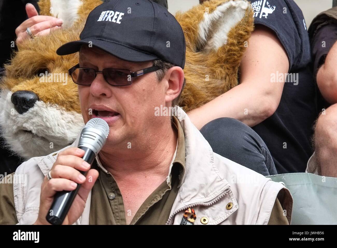 London, UK 12th August 2017. Will Travers son of  Virginia McKenna,Born Free Foundation addresses the crowd. To coincide with the first day of the grouse season known as the 'Glorious 12th' hundreds of Anti Blood Sports protesters gather  outside Downing Street to demonstrate against the killing of animals for sport. :Credit: Claire Doherty Alamy/Live News Stock Photo