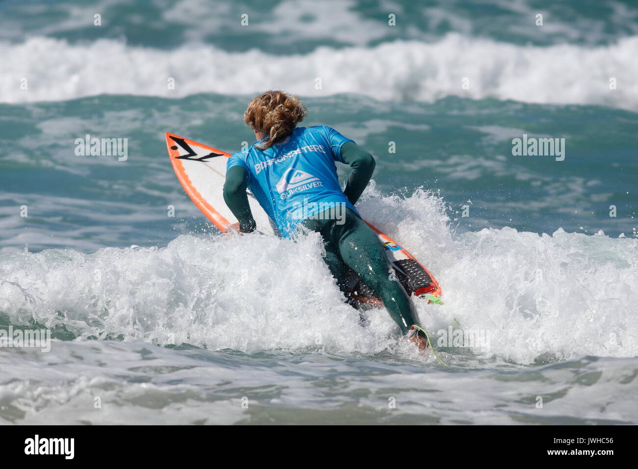Fistral Beach, Newquay, Cornwall, UK. 12th Aug, 2017. Surfers take part in Day 4 of the Boardmasters Championship. Competitors from around the world take part in the UK's biggest surf contest. Australian Lliam Mortensen shows his skills. Credit: Nicholas Burningham/Alamy Live News Stock Photo