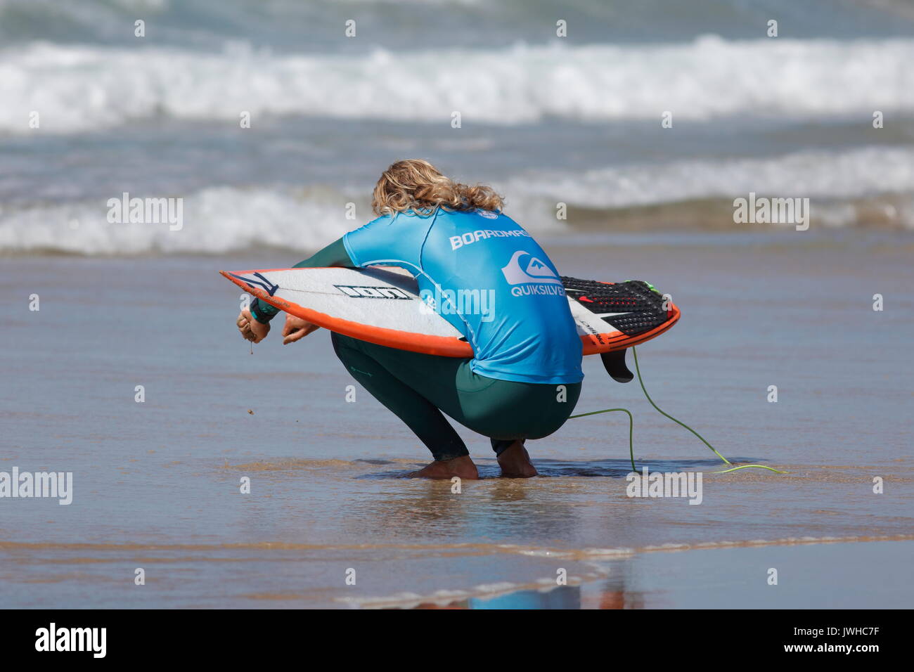 Fistral Beach, Newquay, Cornwall, UK. 12th Aug, 2017. Surfers take part in Day 4 of the Boardmasters Championship. Competitors from around the world take part in the UK's biggest surf contest. Australian Lliam Mortensen shows his skills. Credit: Nicholas Burningham/Alamy Live News Stock Photo