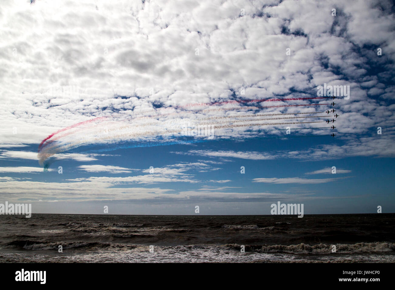 Blackpool, Lancashire, UK. 12th Aug, 2017. RAF Red Arrows over the sea at Blackpool Credit: Russell Millner/Alamy Live News Stock Photo