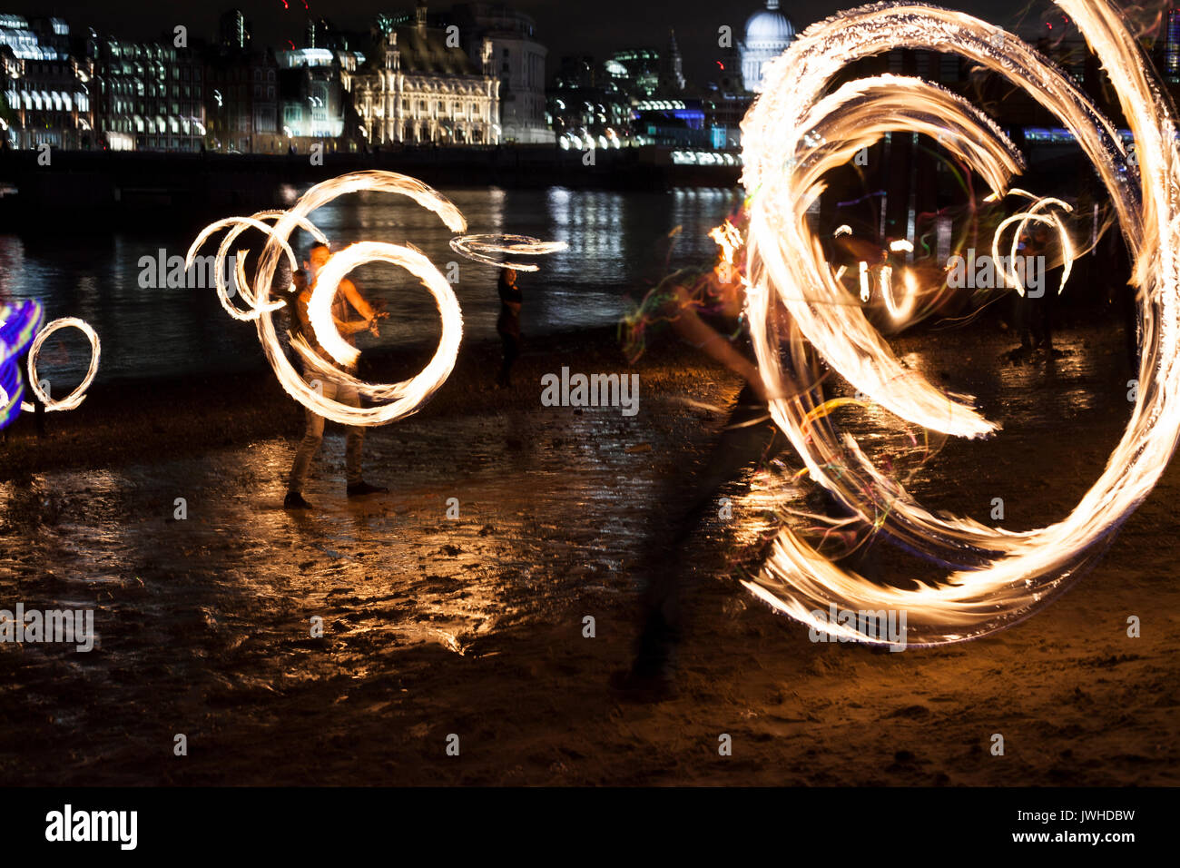 London, UK. 11th Aug, 2017. London fire spinning event, every full moon London fire performers meet up at the Southbank to play with fire.  London 11/08/2017 –Katja Heber/Lichtermeer Credit: Katja Heber/Alamy Live News Stock Photo