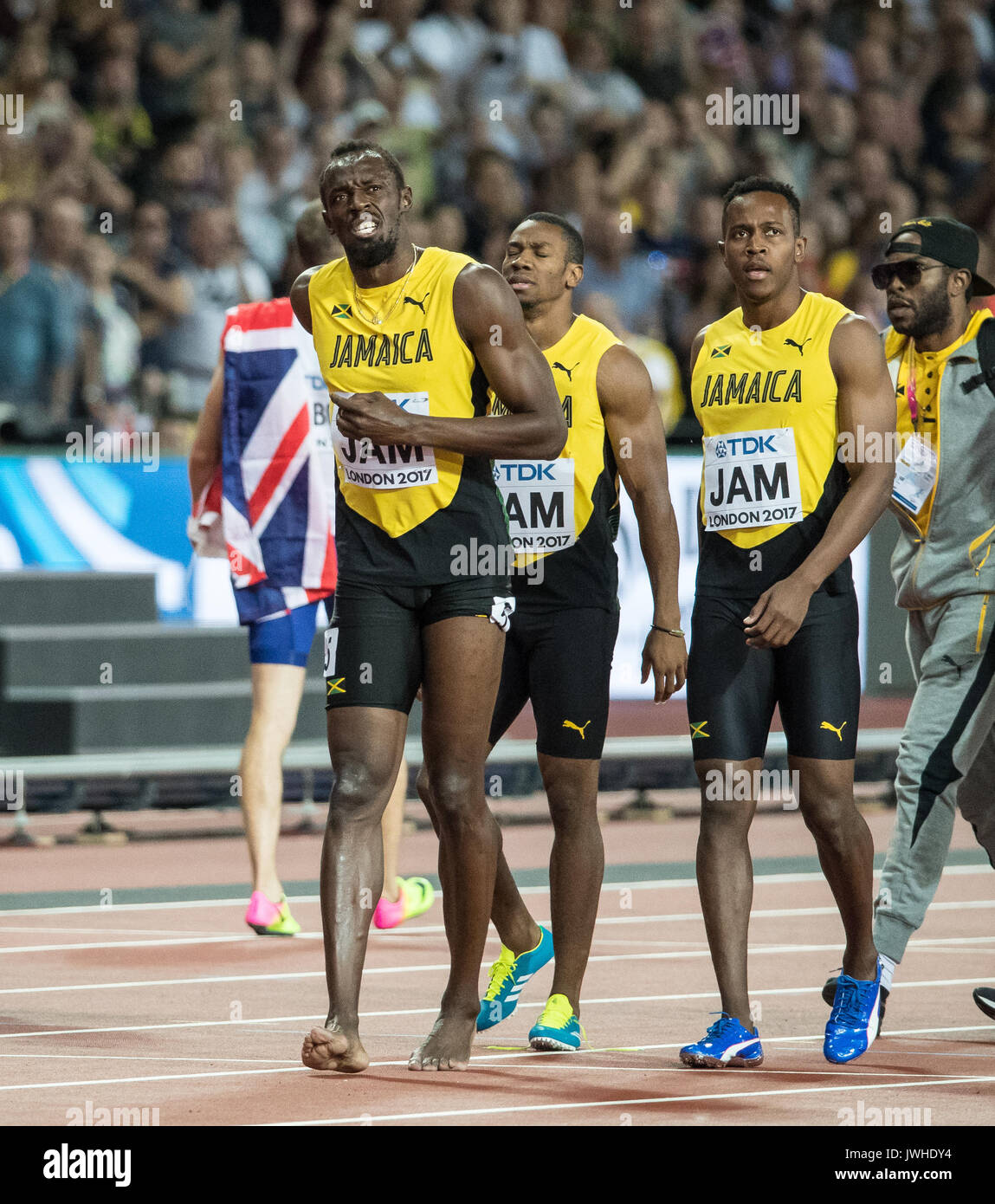 London, UK. 12th Aug, 2017. Usain BOLT of Jamaica walks off with teammates  in pain after going down injured on the final leg of the 4x100 metre relay  during the IAAF World