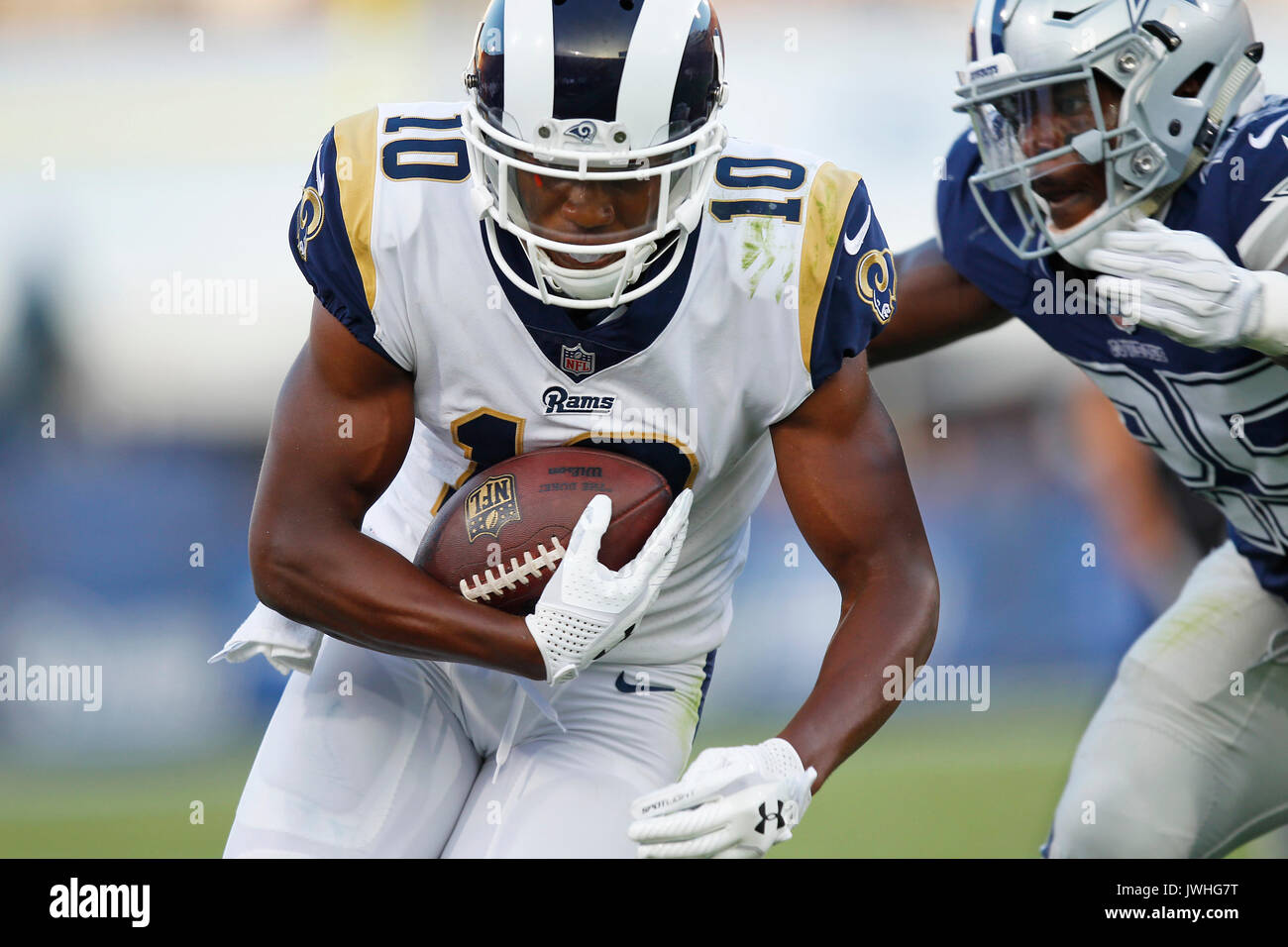 Los Angeles, CA, USA. 12th Aug, 2017.  Los Angeles Rams Pharoh Cooper gets hit by Dallas Cowboys Xavier Woods in the second quarter at the Los Angeles Memorial Coliseum. Credit: K.C. Alfred/San Diego Union-Tribune/ZUMA Wire/Alamy Live News Stock Photo