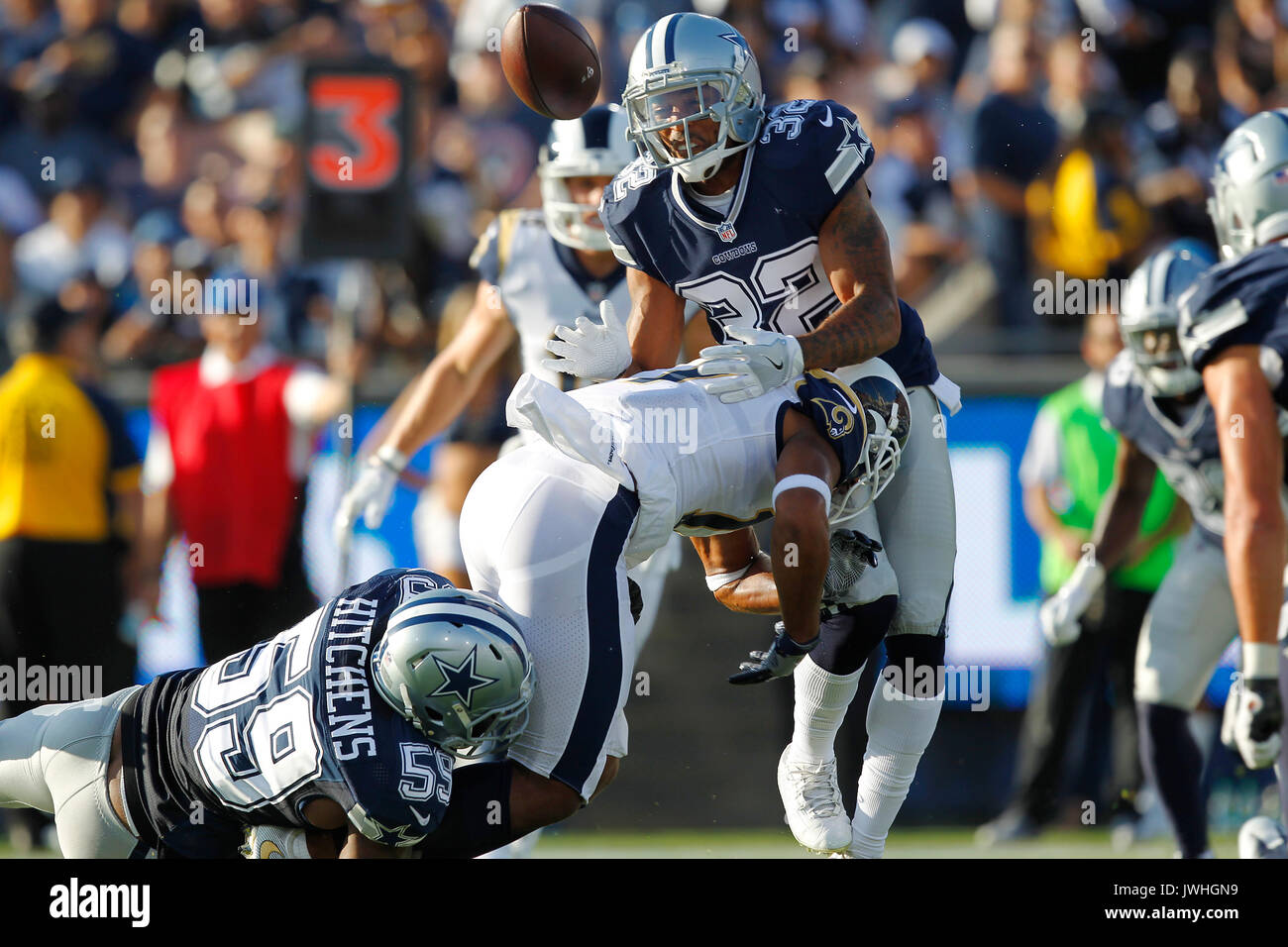 Los Angeles, CA, USA. 12th Aug, 2017. LOS ANGELES, CA - AUGUST 12, 2017 - Los Angeles Rams Robert Woods fumbles the ball and would be recovered by teammate Cooper Kupp for a touchdown in the first quarter against the Dallas Cowboys at the Los Angeles Memorial Coliseum. Cowboys Anthony Hitchens (59), left, as Orlando Scandrick (32) looks on. Credit: K.C. Alfred/San Diego Union-Tribune/ZUMA Wire/Alamy Live News Stock Photo