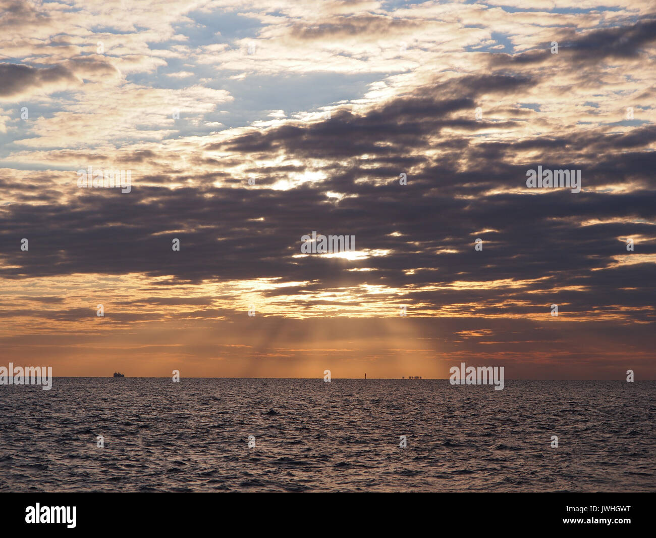 Sheerness, Kent. 13 Aug, 2017. UK Weather: a red sky in the morning ('Shepherd's warning') as the sun broke through cloud cover. Credit: James Bell/Alamy Live News Stock Photo