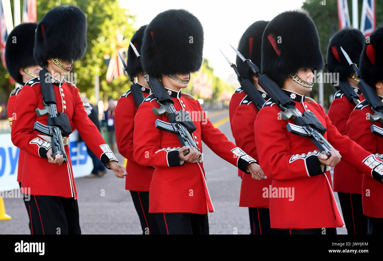 London, UK. 13th Aug, 2017. Members of the Queen's Guard cross The Mall during the 50 kilometre marathon event at the IAAF London 2017 World Athletics Championships in London, United Kingdom, 13 August 2017. Photo: Rainer Jensen/dpa/Alamy Live News Stock Photo