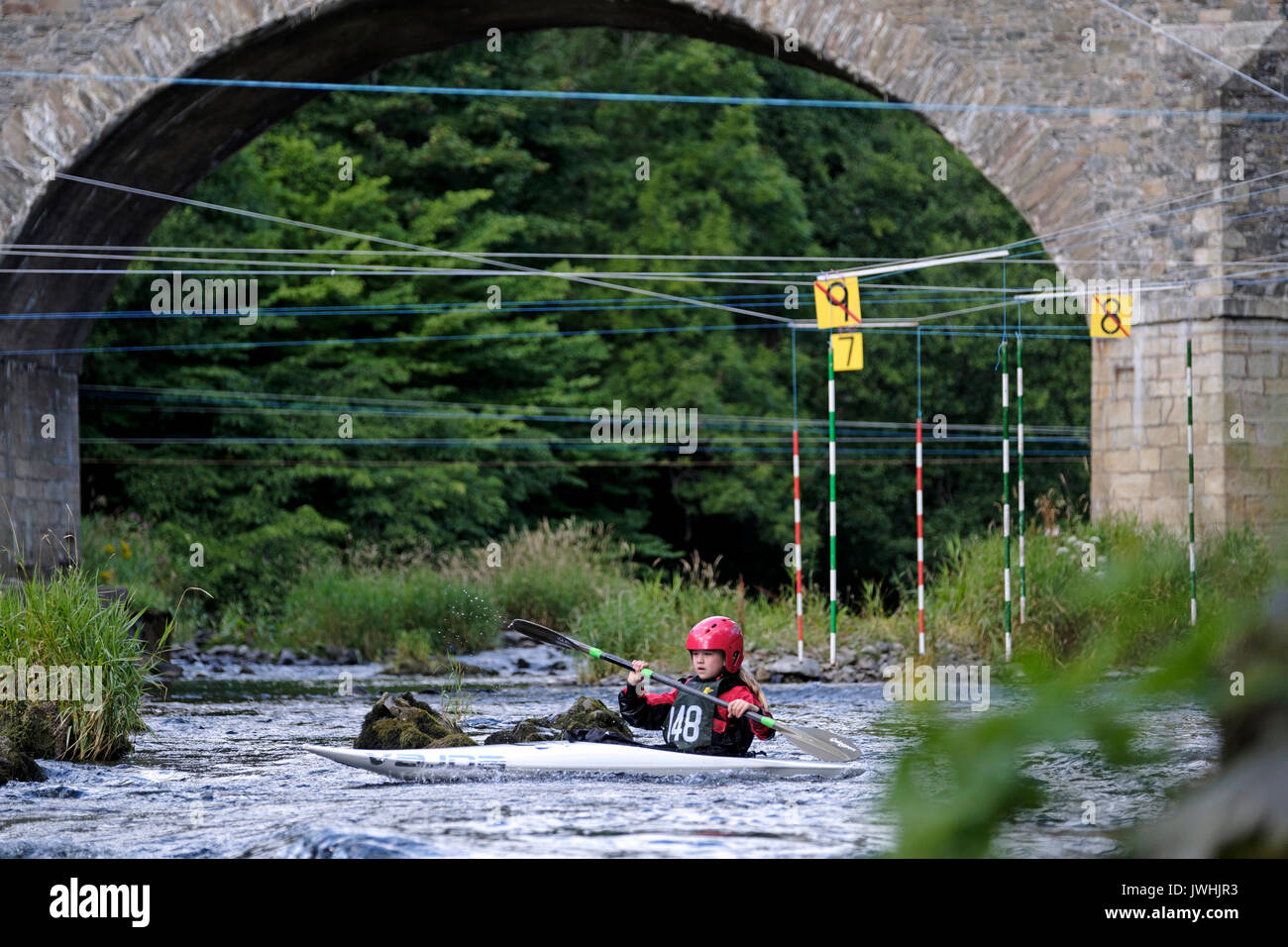 River Tweed, Yair Bridge, Selkirk, UK. 13th August 2017. Canoe Slalom at Yair Bridge A canoeist negotiates the slalom course at Yair Bridge, on the River Tweed, near Selkirk during the Div 2/3 and Scottish J14 & J12 Championships. The event organised by local club Leithen Water Paddlers. Stock Photo