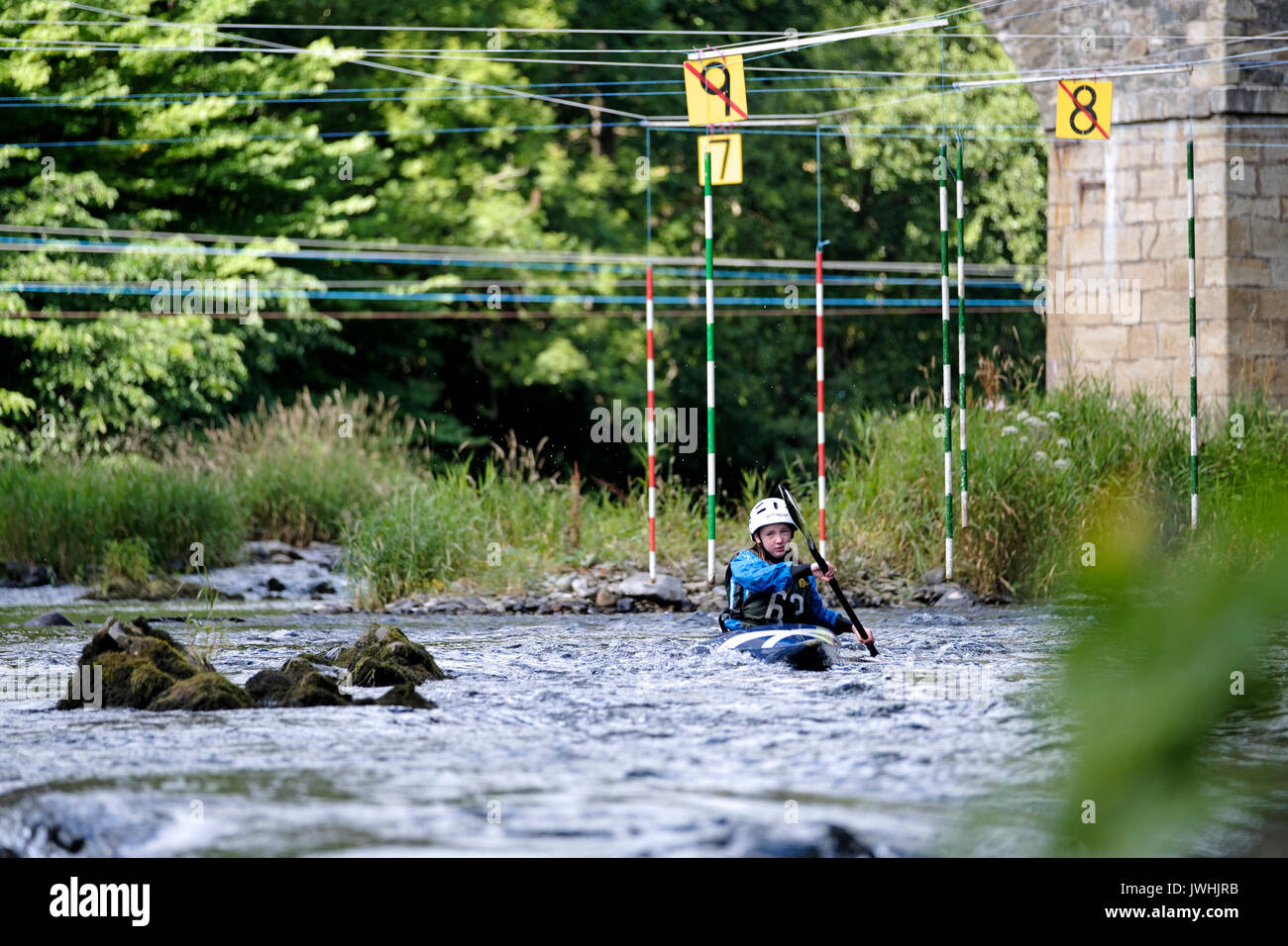 River Tweed, Yair Bridge, Selkirk, UK. 13th August 2017. Canoe Slalom at Yair Bridge A canoeist negotiates the slalom course at Yair Bridge, on the River Tweed, near Selkirk during the Div 2/3 and Scottish J14 & J12 Championships. The event organised by local club Leithen Water Paddlers. Stock Photo