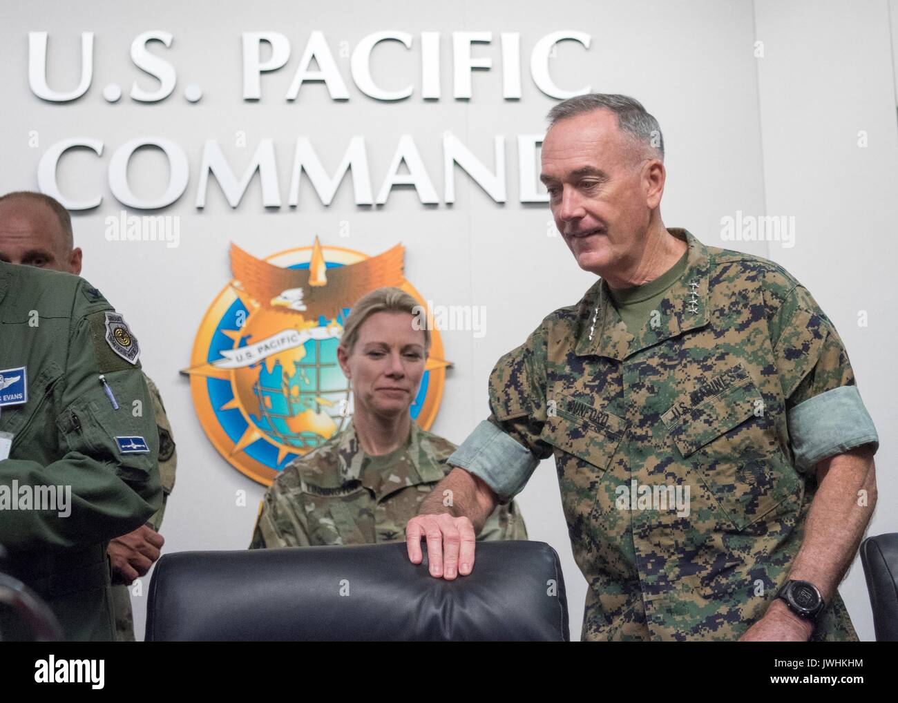 U.S. Chairman of the Joint Chiefs Gen. Joseph Dunford, right, before meeting with commander of the U.S. Pacific Command Adm. Harry Harris in PACOM Headquarters at Joint Base Pearl Harbor-Hickam August 11, 2017 in Honolulu, Hawaii. The two are meeting as tensions rise with North Korea over nuclear and ballistic missiles tests. Stock Photo