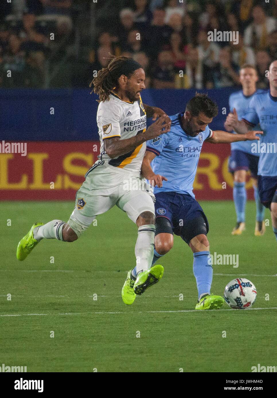 Carson, USA. 12th Aug, 2017. Jermaine Jones (L) of the Los Angeles Galaxy vies with David Villa of New York FC during the 2017 Major League Soccer (MLS) match between Los Angeles Galaxy and New York FC in Carson, California, the U.S., Aug. 12, 2017. Credit: Javier Rojas/Xinhua/Alamy Live News Stock Photo